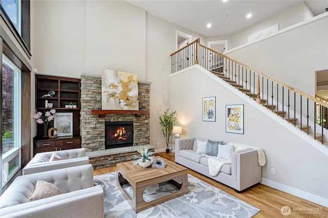 8019 149th Pl SE, Newcastle, WA 98059 - living area with a towering ceiling, wood finished floors, plenty of natural light, stairway, and recessed lighting
