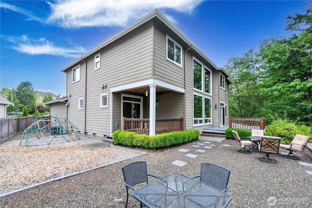 8019 149th Pl SE, Newcastle, WA 98059 - rear view of property with outdoor dining area, a playground, a deck, and a patio area