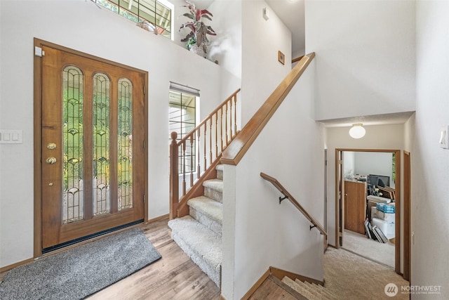 16714 Broadway Ave, Snohomish, WA 98296 - entryway featuring a high ceiling, wood finished floors, and stairs