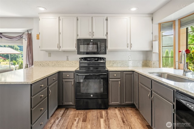 16714 Broadway Ave, Snohomish, WA 98296 - kitchen with black appliances, gray cabinets, light stone counters, plenty of natural light, and recessed lighting