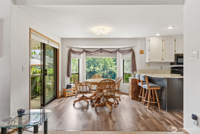 16714 Broadway Ave, Snohomish, WA 98296 - dining room with wood finished floors and recessed lighting