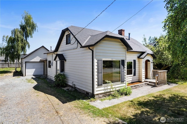 136 D St, Buckley, WA 98321 - view of side of home featuring a chimney and a shingled roof