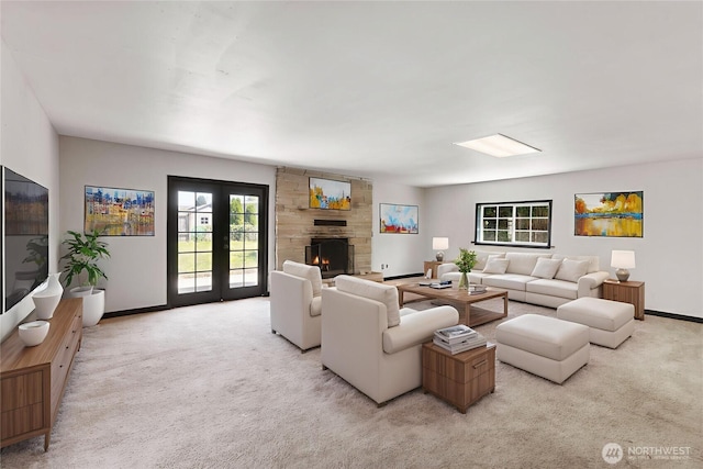 136 D St, Buckley, WA 98321 - living area with light colored carpet, a stone fireplace, and french doors