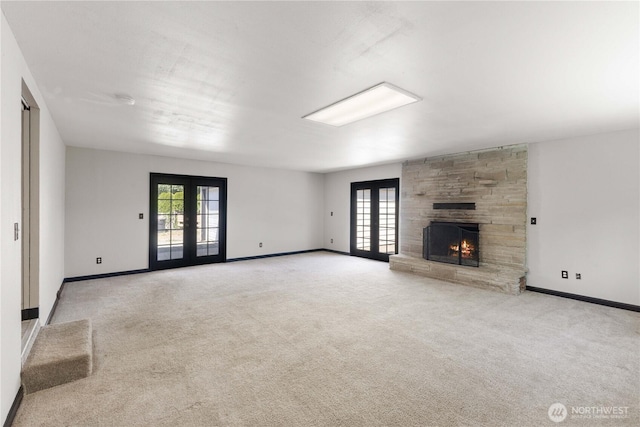 136 D St, Buckley, WA 98321 - unfurnished living room with french doors, carpet flooring, and plenty of natural light