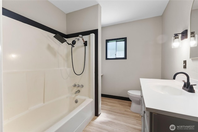 136 D St, Buckley, WA 98321 - bathroom with vanity, wood finished floors, and shower / bathtub combination