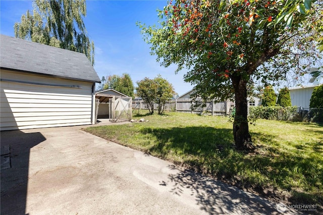 136 D St, Buckley, WA 98321 - view of yard featuring an outdoor structure and a garage
