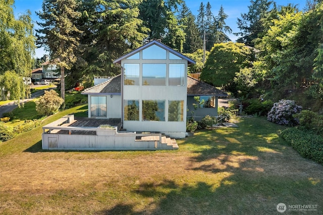 10634 SW Cowan Rd, Vashon, WA 98070 - back of house featuring a lawn