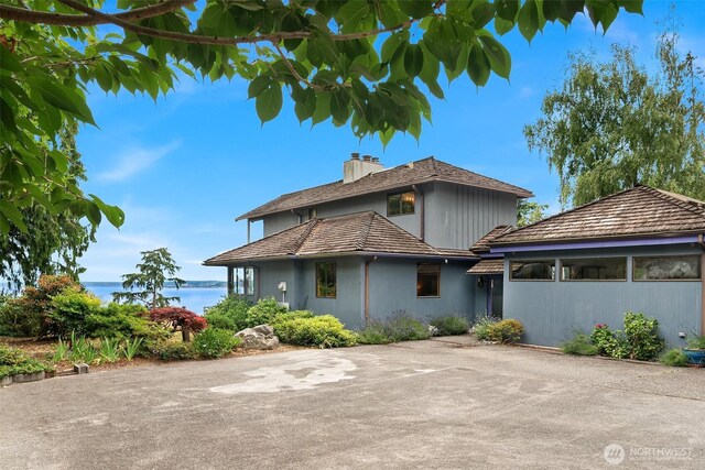10634 SW Cowan Rd, Vashon, WA 98070 - back of property featuring a chimney and a water view