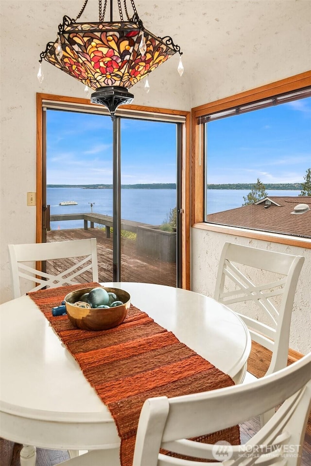 10634 SW Cowan Rd, Vashon, WA 98070 - dining room with a water view and healthy amount of natural light