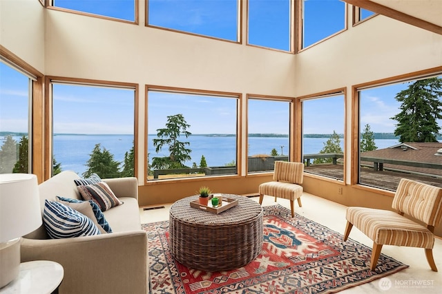 10634 SW Cowan Rd, Vashon, WA 98070 - sunroom with a water view, plenty of natural light, and a towering ceiling