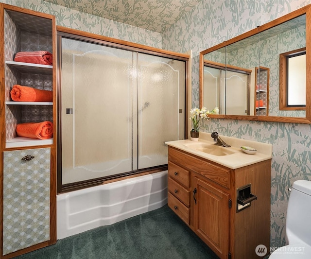 10634 SW Cowan Rd, Vashon, WA 98070 - full bathroom with wallpapered walls, vanity, and combined bath / shower with glass door