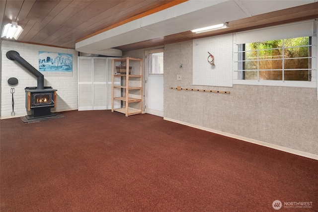 10634 SW Cowan Rd, Vashon, WA 98070 - below grade area featuring a wood stove and carpet