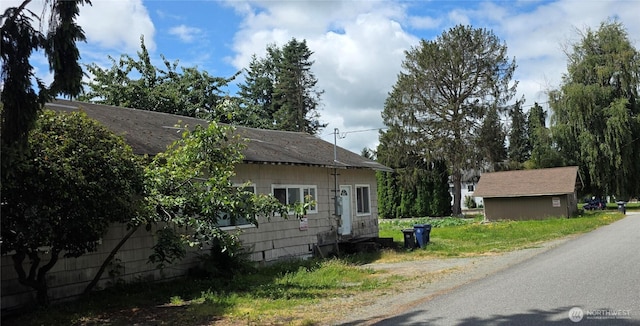 303 S Baker St, Mount Vernon, WA 98273 - view of property exterior with roof with shingles