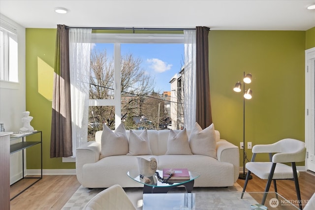 4422 Woodlawn Ave N Unit 213, Seattle, WA 98103 - living area featuring wood finished floors and baseboards