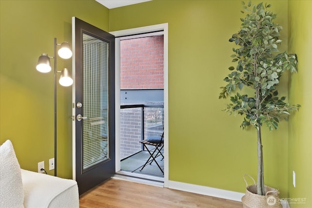 4422 Woodlawn Ave N Unit 213, Seattle, WA 98103 - doorway to outside with wood finished floors and baseboards