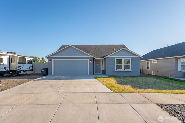 1205 W Sequoia Rd, Moses Lake, WA 98837 - ranch-style home featuring a garage and driveway