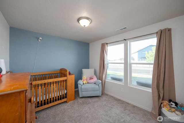 1205 W Sequoia Rd, Moses Lake, WA 98837 - carpeted bedroom with a crib and baseboards