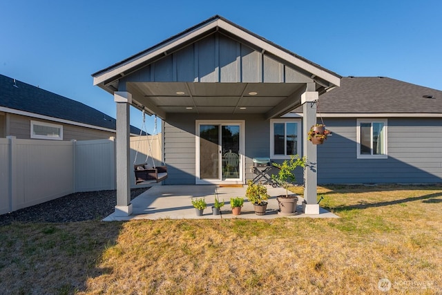 1205 W Sequoia Rd, Moses Lake, WA 98837 - back of house featuring board and batten siding and a patio area