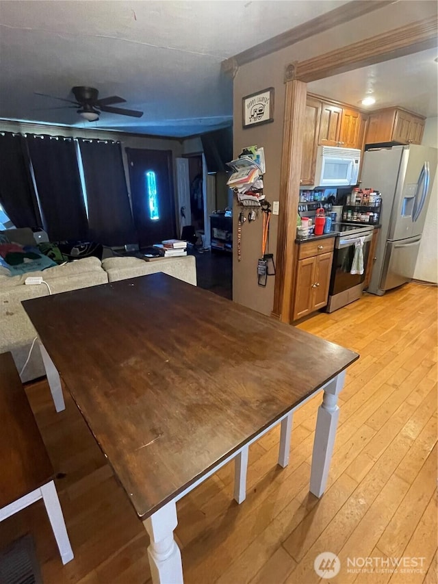 1610 M St NE, Auburn, WA 98002 - dining area with light wood-style floors and a ceiling fan
