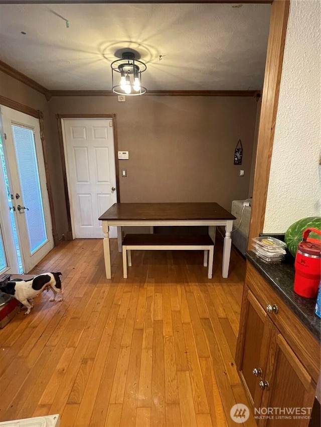 1610 M St NE, Auburn, WA 98002 - unfurnished dining area featuring light wood-style floors and ornamental molding