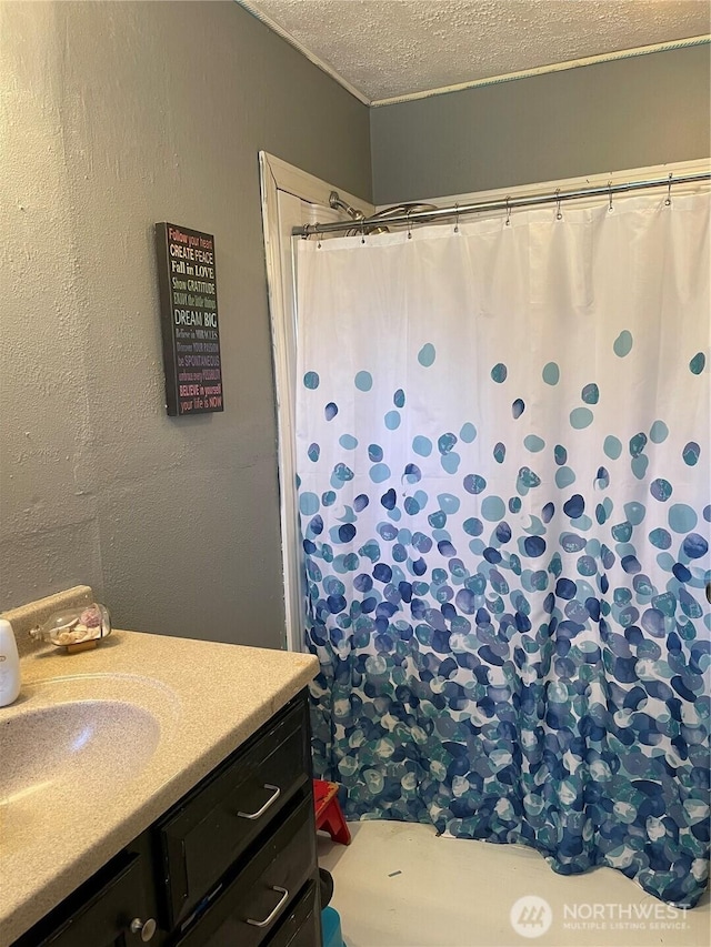1610 M St NE, Auburn, WA 98002 - full bathroom featuring vanity, a textured ceiling, and a shower with shower curtain