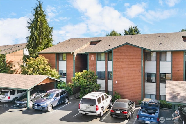 7310 N Skyview Ln Unit J-301, Tacoma, WA 98406 - view of property featuring uncovered parking