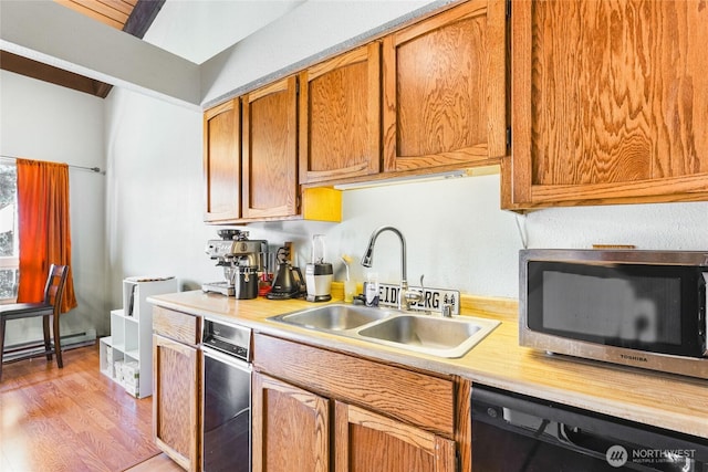 7310 N Skyview Ln Unit J-301, Tacoma, WA 98406 - kitchen with stainless steel microwave, dishwasher, light countertops, and light wood-style floors