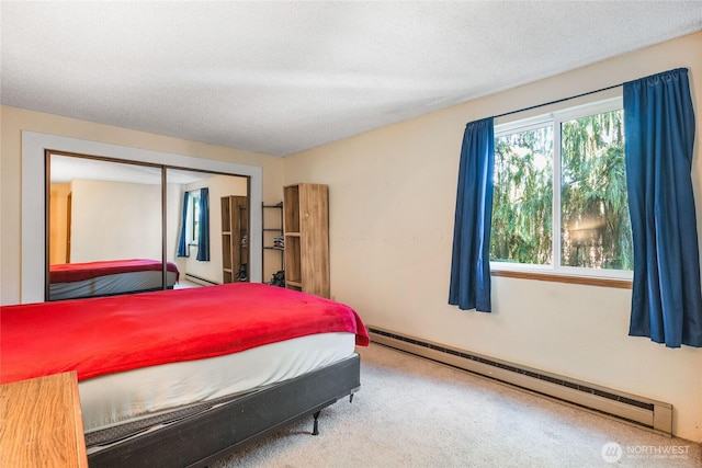 7310 N Skyview Ln Unit J-301, Tacoma, WA 98406 - carpeted bedroom with a baseboard heating unit and a closet