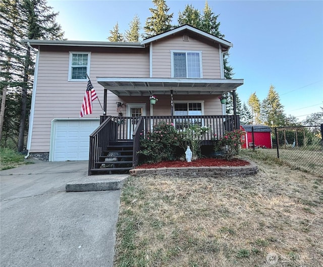 8389 SW Harmon St, Port Orchard, WA 98367 - view of front of house with an attached garage, driveway, and a porch