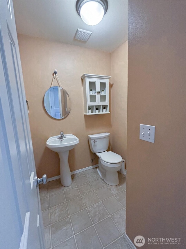 8389 SW Harmon St, Port Orchard, WA 98367 - half bath featuring tile patterned flooring and toilet