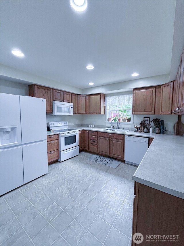 8389 SW Harmon St, Port Orchard, WA 98367 - kitchen with white appliances, light countertops, recessed lighting, and light tile patterned floors