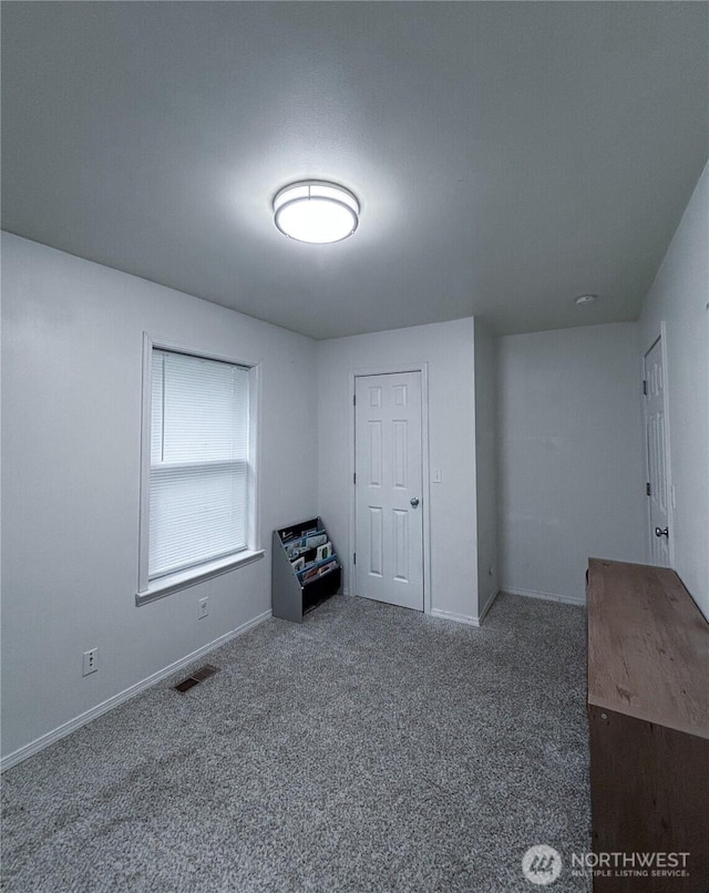 8389 SW Harmon St, Port Orchard, WA 98367 - spare room featuring carpet and baseboards