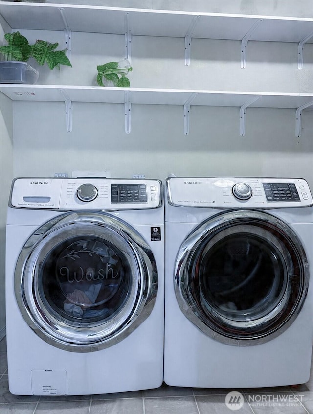 8389 SW Harmon St, Port Orchard, WA 98367 - laundry room with tile patterned flooring and washing machine and clothes dryer