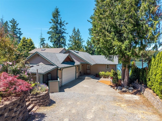 21945 Promontory Ct SE, Yelm, WA 98597 - single story home with driveway, a garage, and roof with shingles