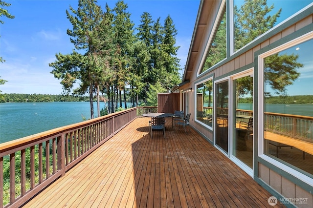 21945 Promontory Ct SE, Yelm, WA 98597 - deck with outdoor dining space and a water view