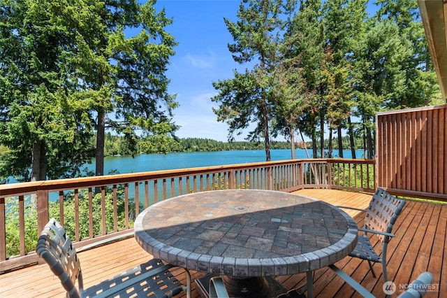 21945 Promontory Ct SE, Yelm, WA 98597 - wooden terrace with a water view and outdoor dining space