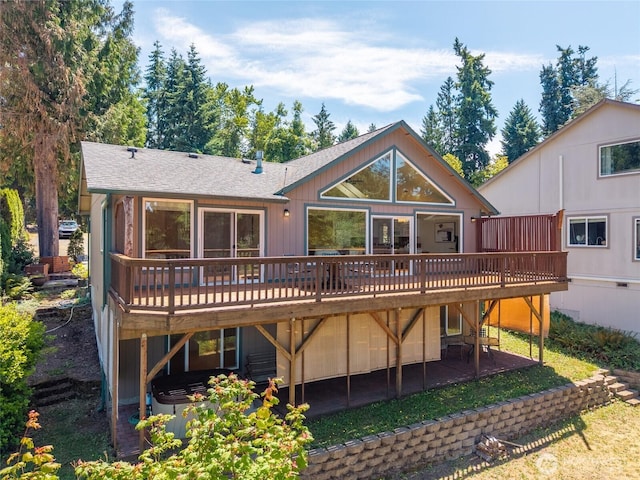 21945 Promontory Ct SE, Yelm, WA 98597 - rear view of house featuring a wooden deck, a hot tub, and roof with shingles
