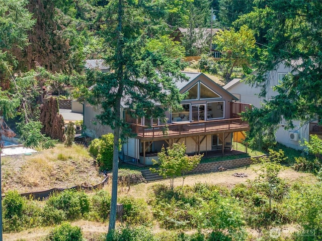 21945 Promontory Ct SE, Yelm, WA 98597 - rear view of house with a wooden deck