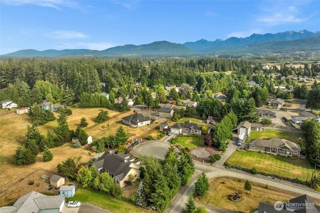 461 Klahhane Rd, Sequim, WA 98382 - aerial perspective of suburban area with a mountainous background and a heavily wooded area