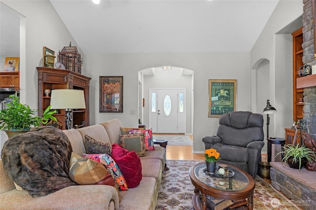 461 Klahhane Rd, Sequim, WA 98382 - living area featuring arched walkways, wood finished floors, and lofted ceiling