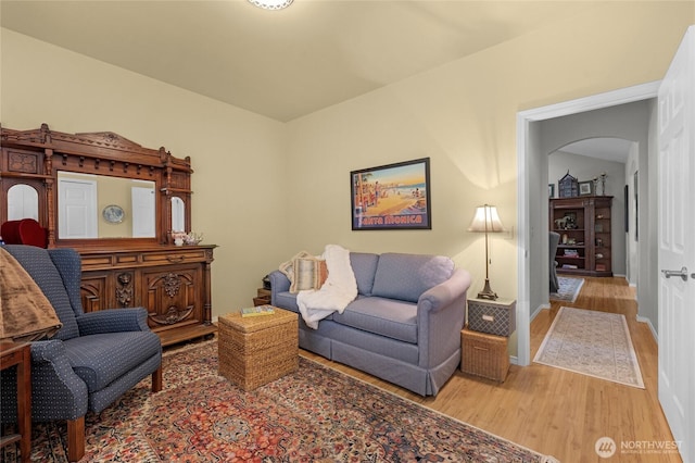 461 Klahhane Rd, Sequim, WA 98382 - living room featuring arched walkways and wood finished floors