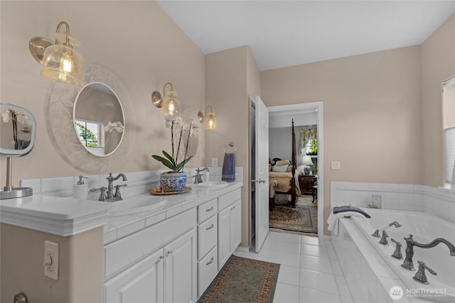 461 Klahhane Rd, Sequim, WA 98382 - ensuite bathroom with double vanity, a garden tub, healthy amount of natural light, and tile patterned floors