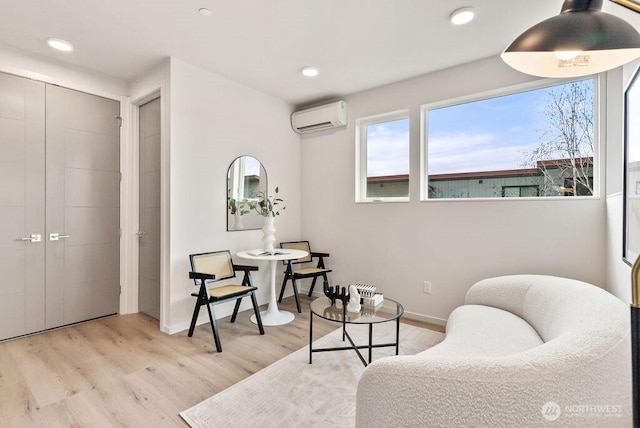 2925 Franklin Ave E Unit A, Seattle, WA 98102 - living area with a wall mounted AC, light wood finished floors, and recessed lighting