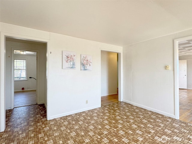 2310 S Laurel St, Port Angeles, WA 98362 - spare room featuring wainscoting and baseboards
