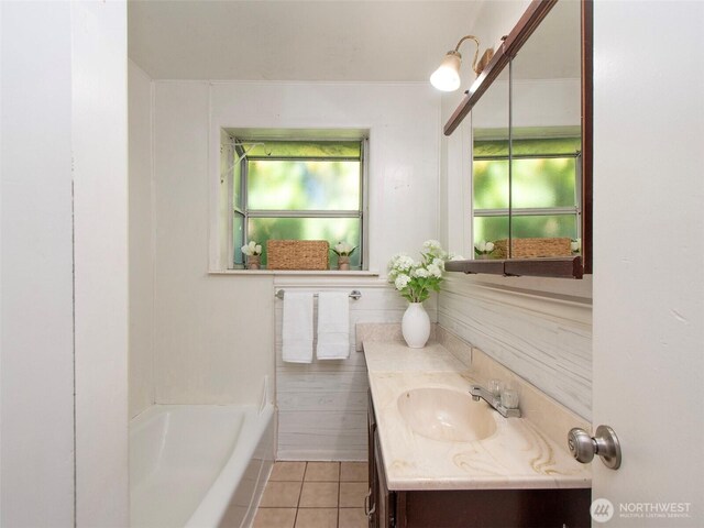 2310 S Laurel St, Port Angeles, WA 98362 - full bath featuring vanity, a tub to relax in, and tile patterned floors