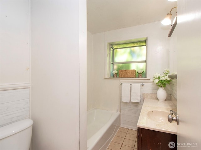 2310 S Laurel St, Port Angeles, WA 98362 - bathroom featuring tile patterned floors, vanity, and a tub to relax in
