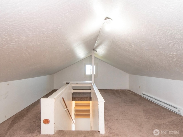2310 S Laurel St, Port Angeles, WA 98362 - bonus room with a baseboard radiator, a textured ceiling, carpet flooring, and vaulted ceiling