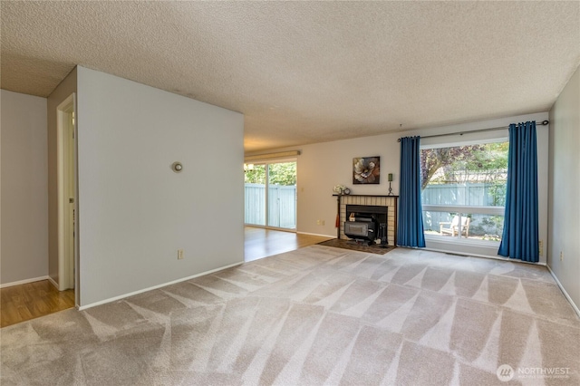 2913 27th St SE, Auburn, WA 98092 - unfurnished living room with carpet and a textured ceiling