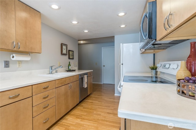 2913 27th St SE, Auburn, WA 98092 - kitchen with appliances with stainless steel finishes, light wood finished floors, light countertops, and recessed lighting