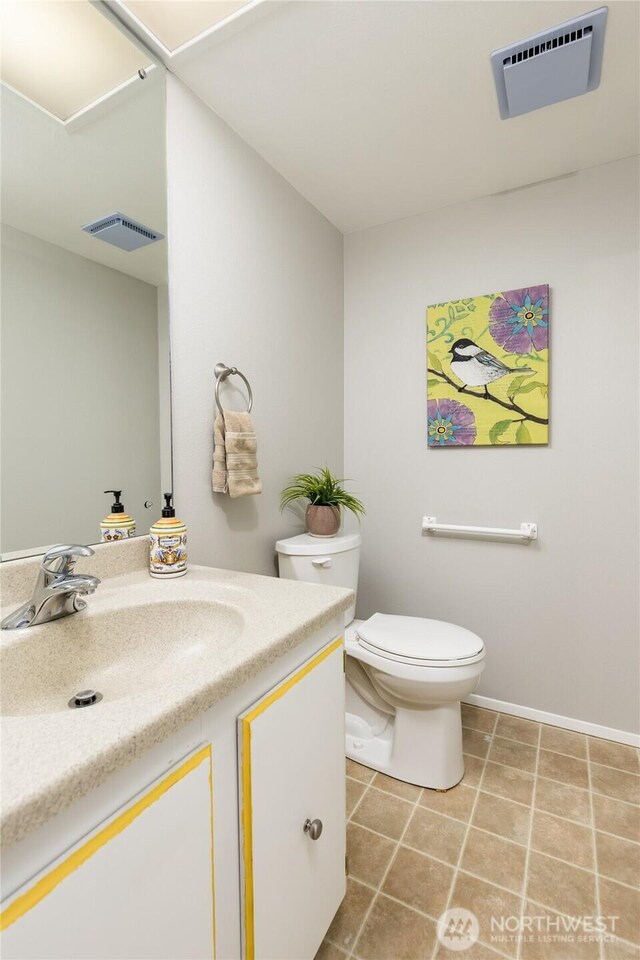 2913 27th St SE, Auburn, WA 98092 - half bathroom with vanity and tile patterned floors